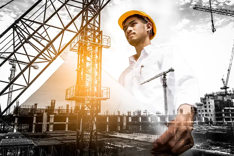 Double exposure of civil engineer holding blueprint with construction site